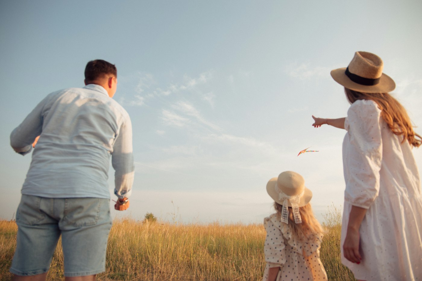 Family flying a kite together - life insurance