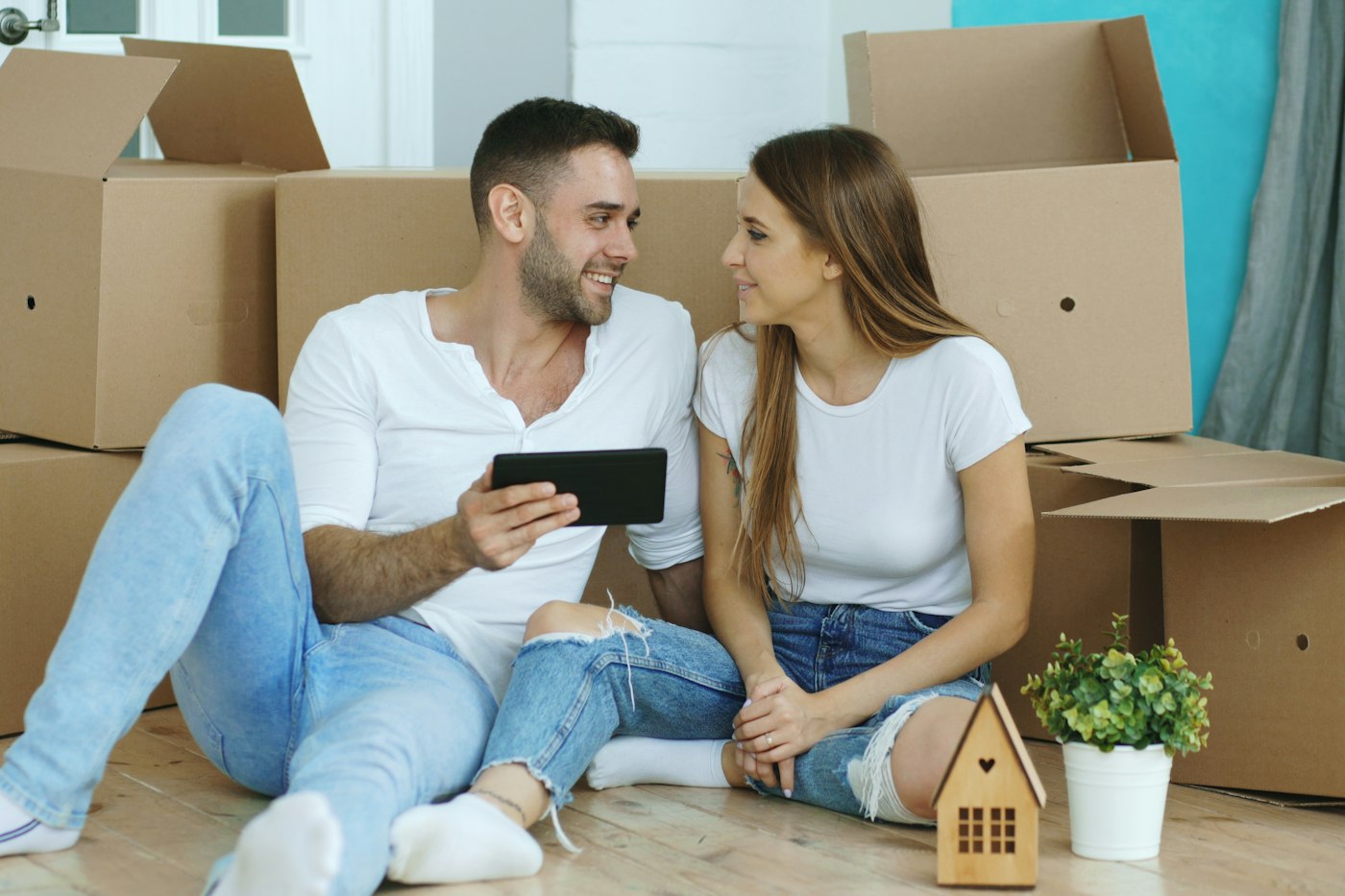 Couple moving into their new home - mortgage repayment cover